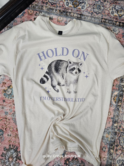 Hold On I'm Overstimulated Raccoon Tee