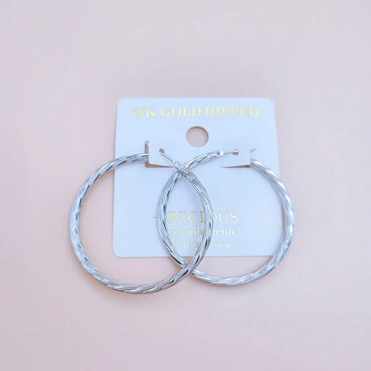 Twist the Tale Hoop Earrings