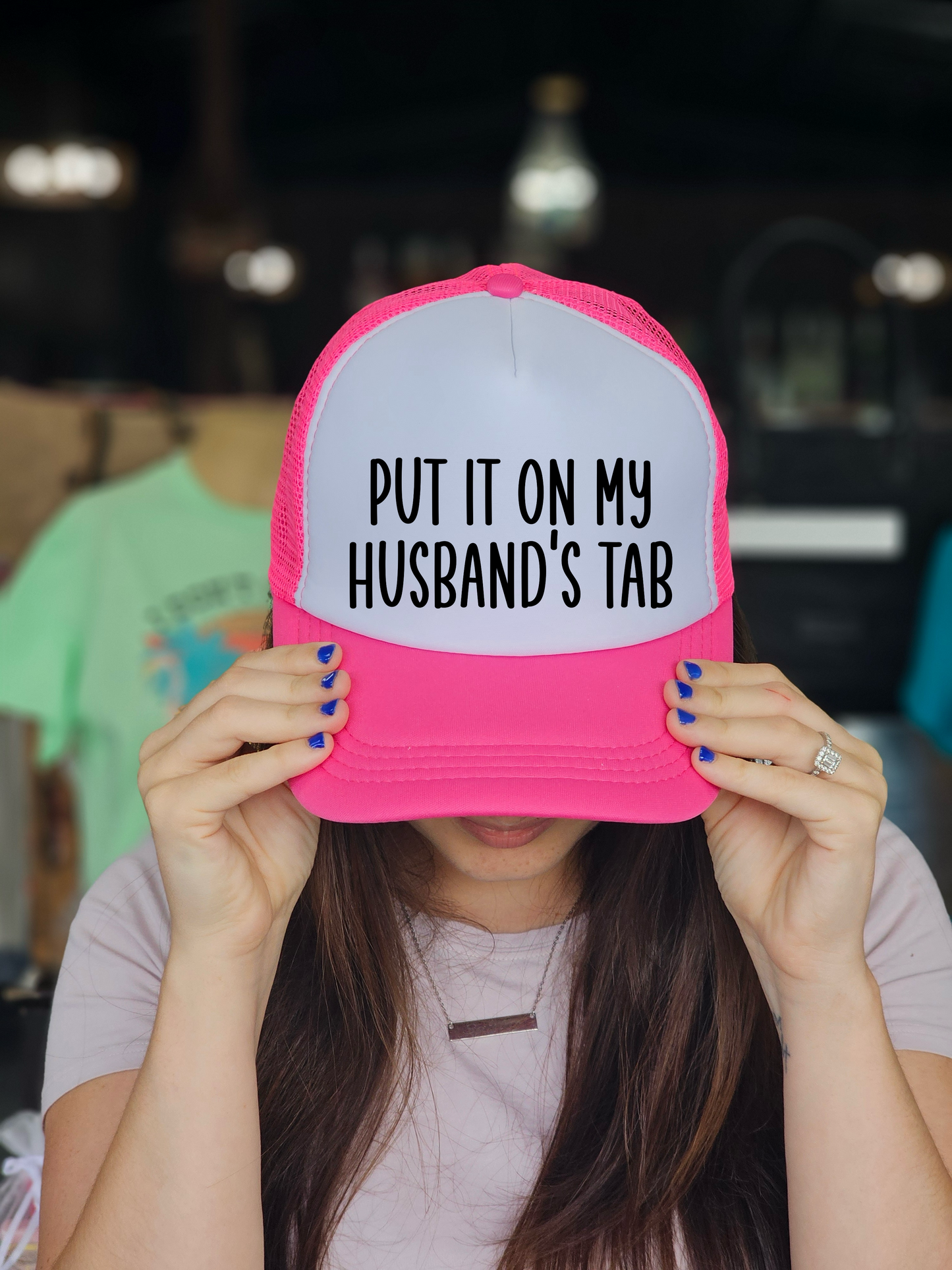 Put It On My Husband's Tab Trucker Hat