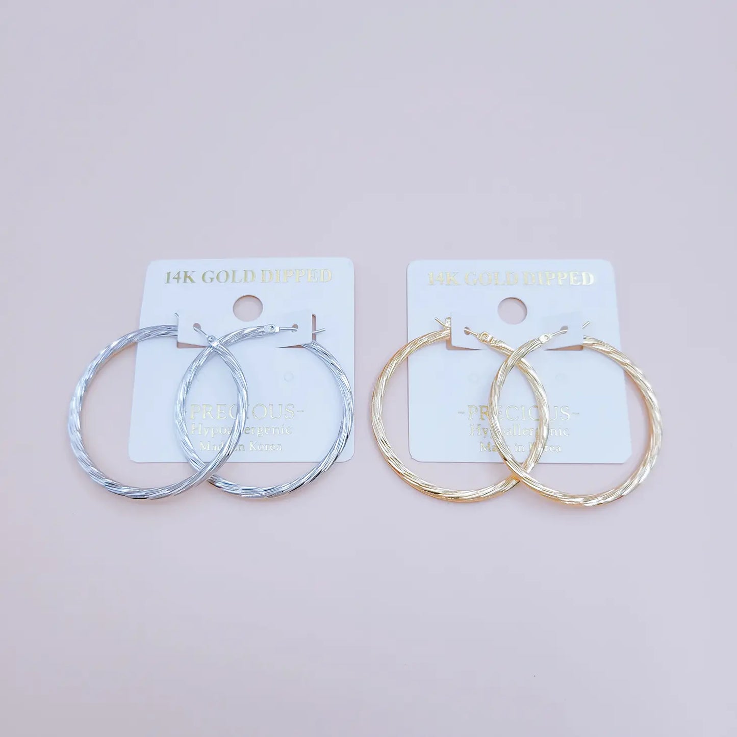 Twist the Tale Hoop Earrings