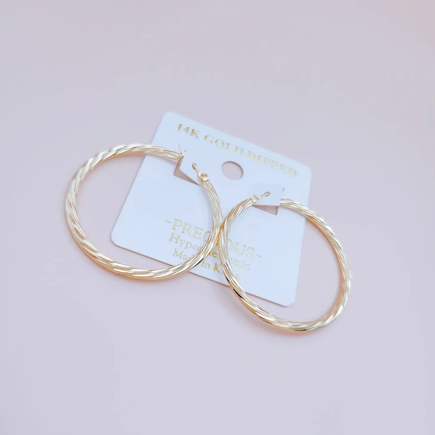 Twist the Tale Hoop Earrings